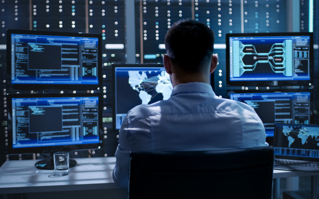 man sitting in control room 